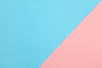 Blue and pink pastel papers geometric lay as background.
