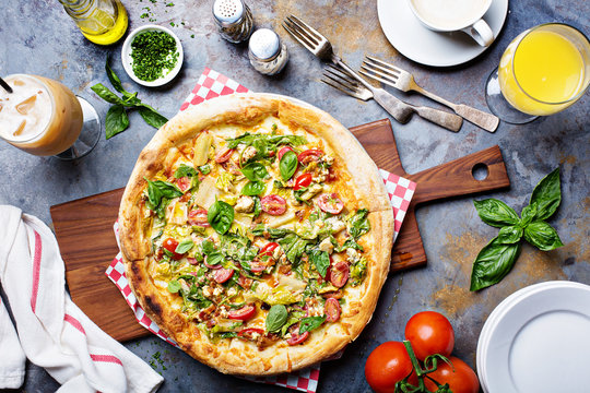 Breakfast pizza with bacon and vegetables