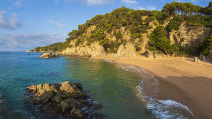 Nudist beach in Spain, Cala sa Boadella, Costa Brava, Lloret de Mar. Sandy spanish beach with rocks...