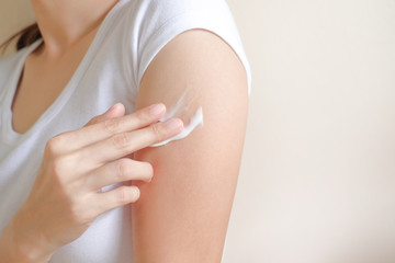 Woman applying arm cream,lotion , Hygiene skin body care concept.