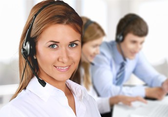 Young woman  with headphones, call center or support concept