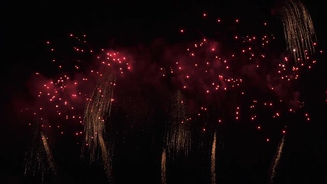 Beautiful colorful fireworks display for celebration on black background, New year holiday concept stock footage video