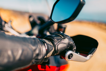 Motorcycle Riders Gloved Hand On The Throttle