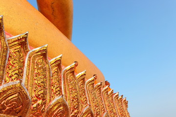 The monks take a photo on the Buddha statue
