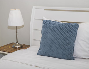 Pillows on bed and lamp
