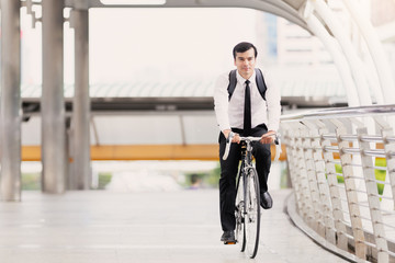 Businessmen riding bicycles