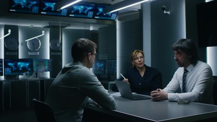 Two Hiring Managers / Recruiters Ask Young Applicant Questions on a Job Interview. Secret Service Recruiting Talented Young Man. Agents Questioning Suspect in Intelligence Agency.