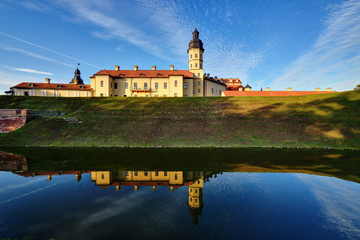 Naklejka na ściany i meble Nesvizh castle, reflected in the lake. Belarus, Europe