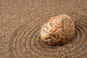 Zen composition. Garden of stones.Calming patterns on the sand.