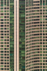 Fototapeta premium View of the windows and balconies of the multi-storey panel apartment house