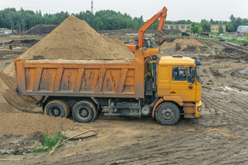 Delivery of sand to the construction site by truck