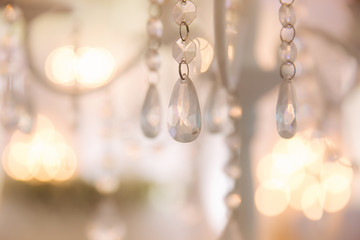 Bokeh of wedding chandelier. Shine of lights