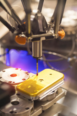 The multi-axis CMM machine measure the aluminum mobile phone part .