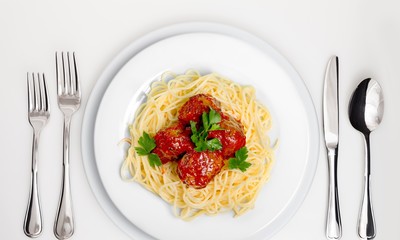Table Setting with Plate, Forks, Knife and Spoon