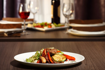 luxury dinner served on the table with glass of red wine