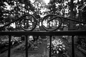 Fototapeta na wymiar Black and white cemetery fence
