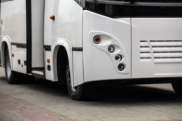 white shuttle bus with an open door © Yuri Bizgaimer