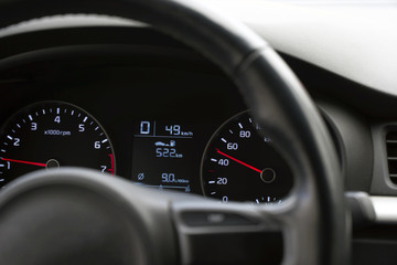 Photo speedometer in the car on the dashboard