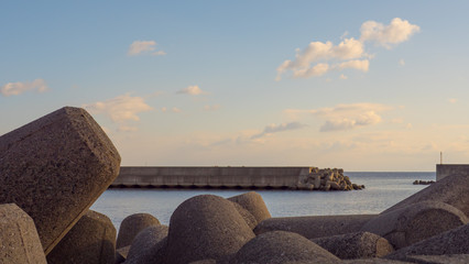 Concrete slabs are designed to absorb the tsunami waves and reduce the intensity before the amount...