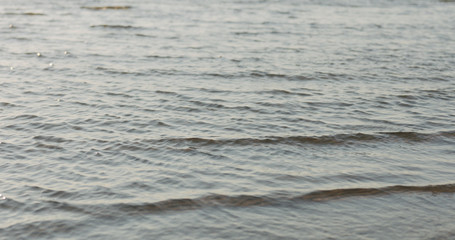 waves on a beach on a windy sunny day