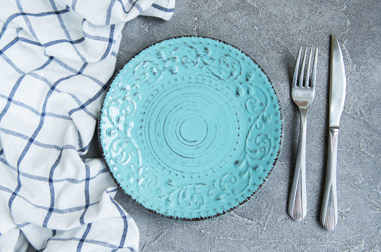 empty plate on tablecloth