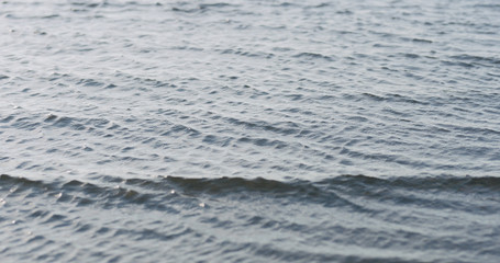 waves on a beach on a windy sunny day