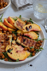 Green salad with grilled halloumi cheese and peaches