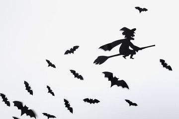 halloween and decoration concept - paper bats flying