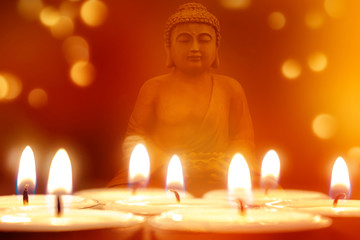 Fototapeta premium buddha statue mit teelichtern