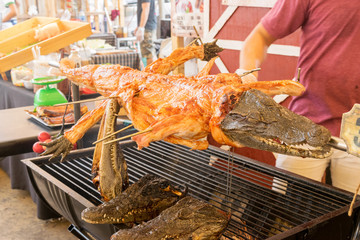 close up grilled crocodile on street food in Thailand