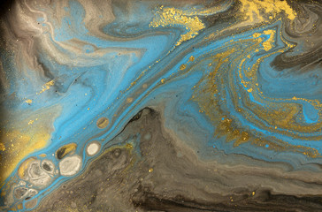 Gold marbling texture design. Blue and golden marble pattern. Fluid art.