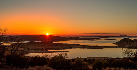 Sunrise over the Gariep Dam in the Karoo natural region in South Africa image in landscape format with copy space