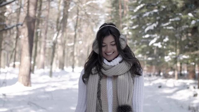 Portrait of cheerful woman walking in winter