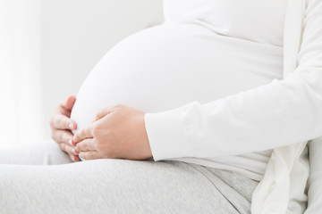 Fototapeta na wymiar Closeup of belly pregnant women, Eight month of pregnancy