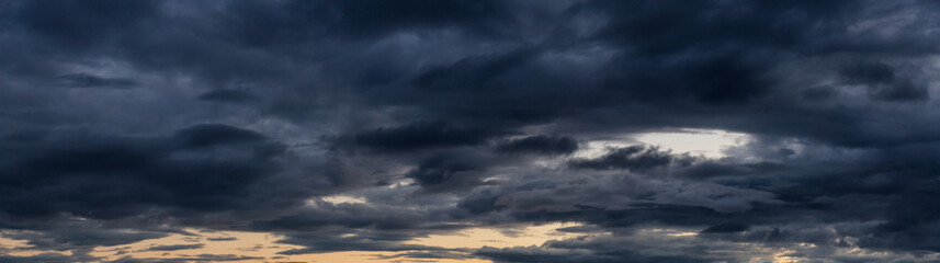 Striking panoramic cloudscape during a vibrant summer sunset. Taken in British Columbia, Canada.