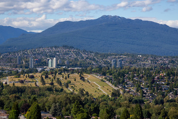 Aerial view of the modern city during a vibrant summer day. Taken in Burnaby, Greater Vancouver, BC, Canada.