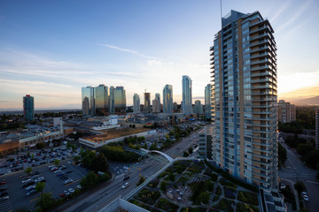 Metrotown, Burnaby, Vancouver, BC, Canada - June 26, 2018: Aerial view of Metropolis Shopping Mall during a vibrant summer sunset.