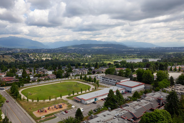 Burnaby, Vancouver, British Columbia, Canada - June 27, 2018: Aerial view of an Elementary School in the suburban area during a vibrant cloudy summer day.