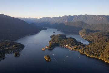 Aerial view of Deep Cove during a vibrant sunny summer evening. Taken in Vancouver, BC, Canada.