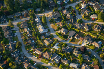 Aerial view of the residential homes during a vibrant sunny summer day. Taken in North Vancouver, British Columbia, Canada.