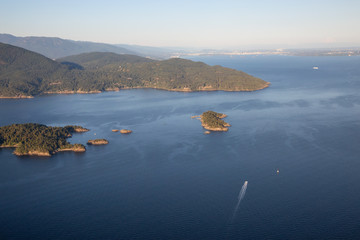 Aerial view of rocky Islands in Howe Sound during a sunny summer evening. Located near Vancouver, BC, Canada.