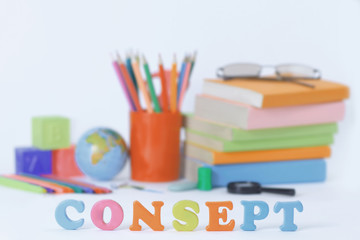 Fototapeta premium word concept on blurred background of school supplies .photo with copy space