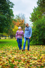 happy young couple   in the autumn park