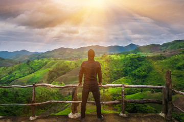 Men are looking at great natural scenery.