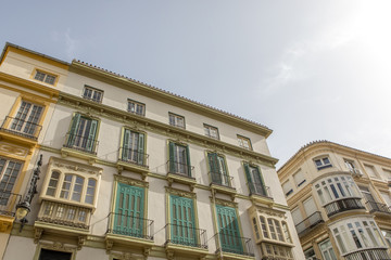 Fototapeta na wymiar Architecture and buildings from XIX century in Larios Street, in Malaga, Spain.