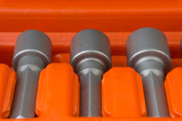 Set of heads for screwdriver (bits) or tools collection close up  with selective focus and crop...
