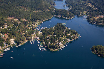 Aerial view of Madeira Park during a sunny summer day. Taken in Sunshine Coast, BC, Canada.