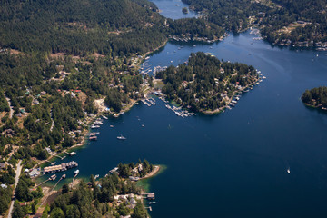 Obraz premium Aerial view of Madeira Park during a sunny summer day. Taken in Sunshine Coast, BC, Canada.