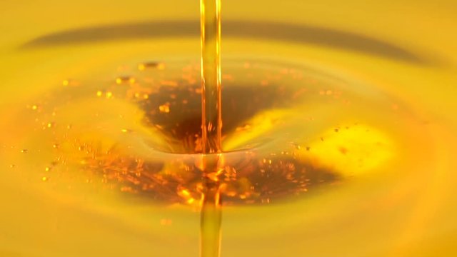 Closeup of Motor oil pouring in slow motion

