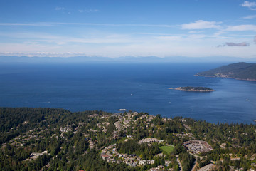 Aerial view of Residential homes by the ocean shore. Taken in Horseshoe Bay, West Vancouver, BC, Canada.